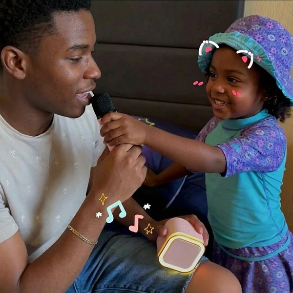 Dad and daughter sharing IROO wireless microphones
